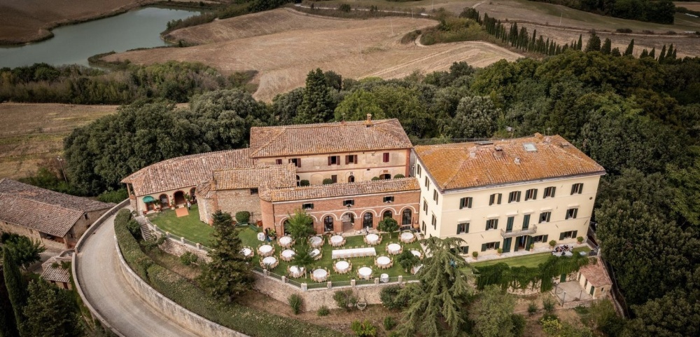 Aerial view of romantic farmhouse for weddings on the hills of Siena Tuscany