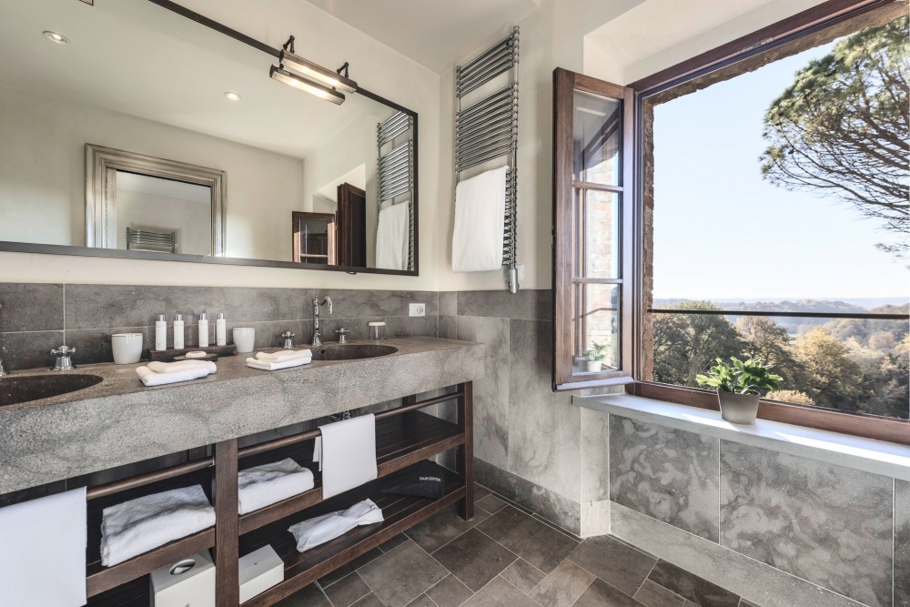 Bathroom with view at luxury wedding resort in Tuscany