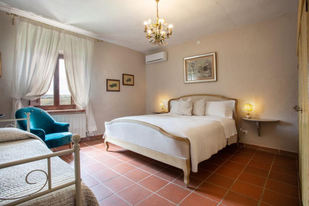 Bedroom of apartment at castle for weddings in Siena