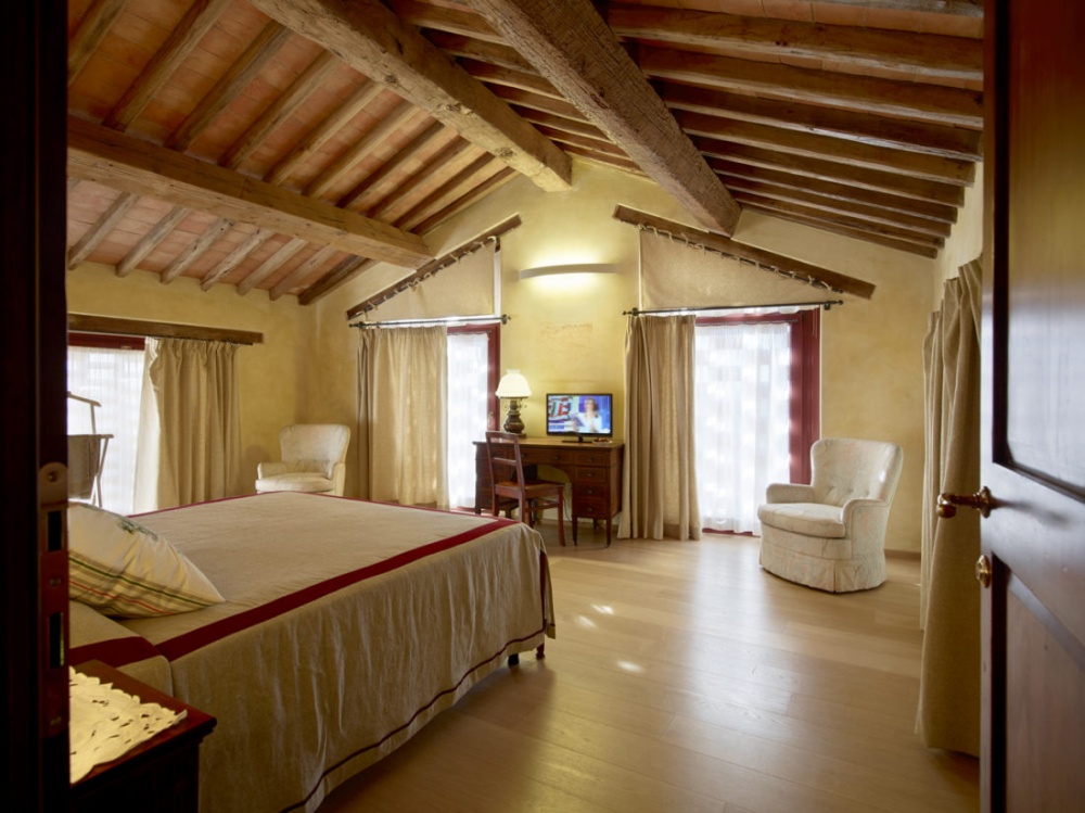 Bedroom of romantic wedding venue in Tuscany