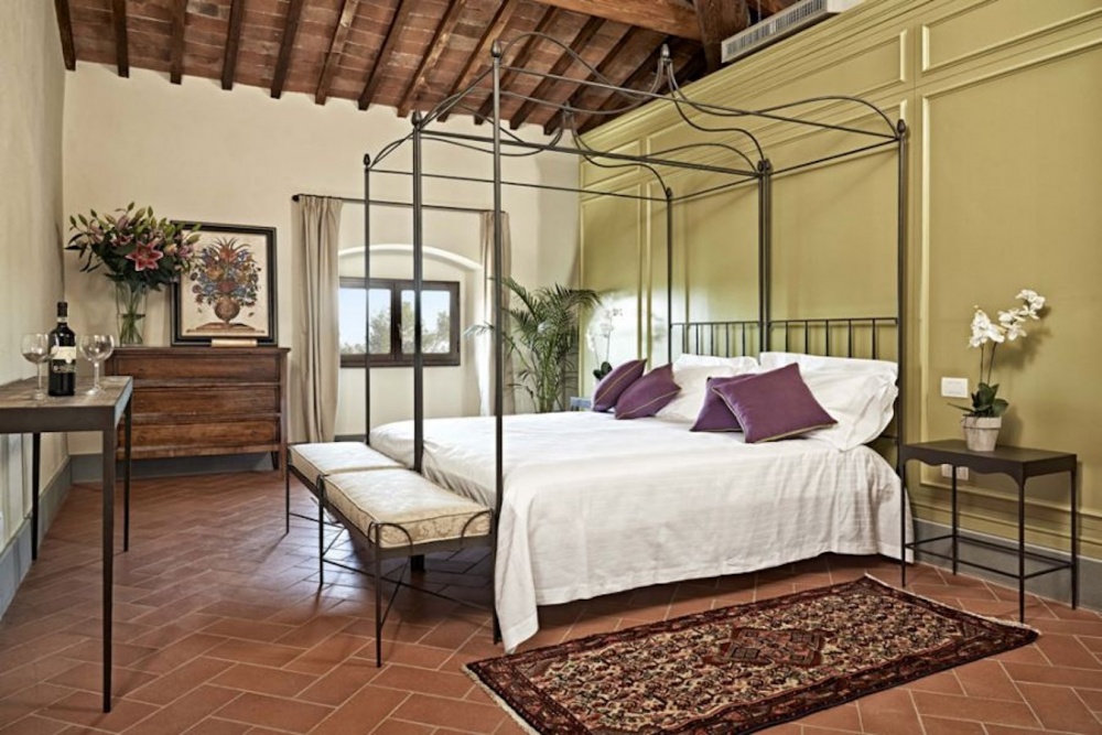 Bedroom with view at wedding rustic villa in Tuscany