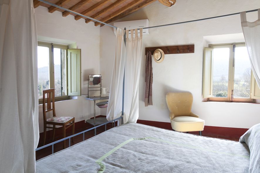 Bedroom with view at wedding villa in Chianti