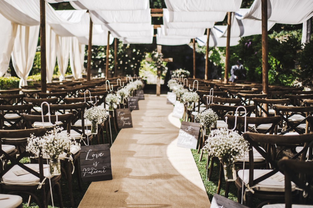 Ceremony under white tent at luxury private villa