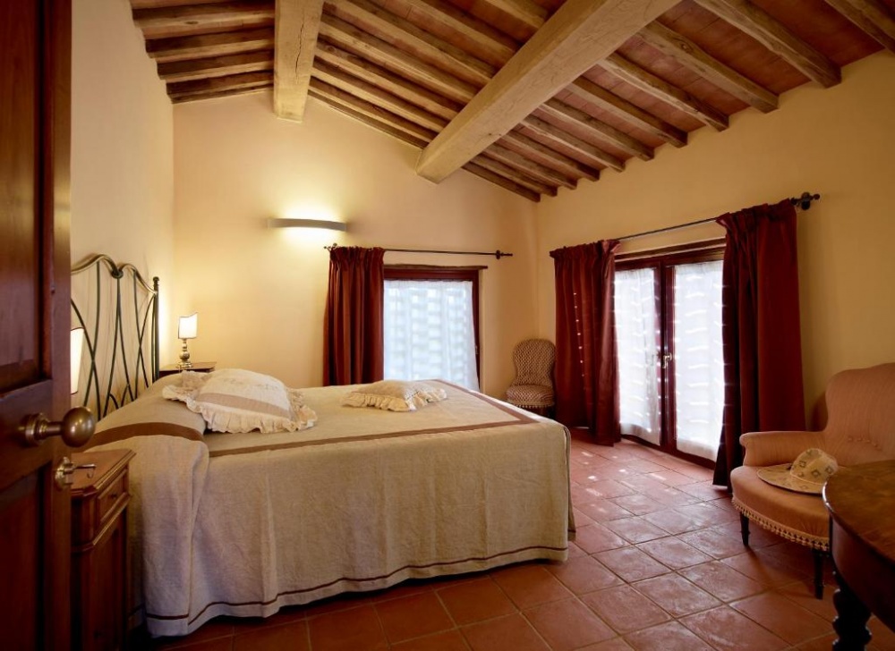 Cosy bedroom at romantic wedding venue in Tuscany