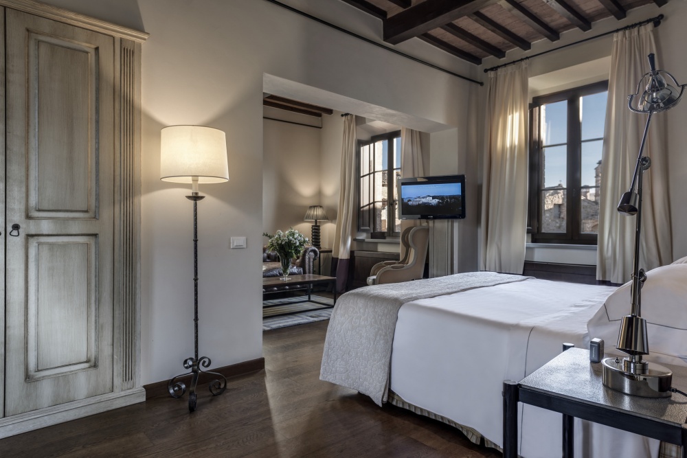Cosy beige bedroom at luxury wedding resort in Tuscany