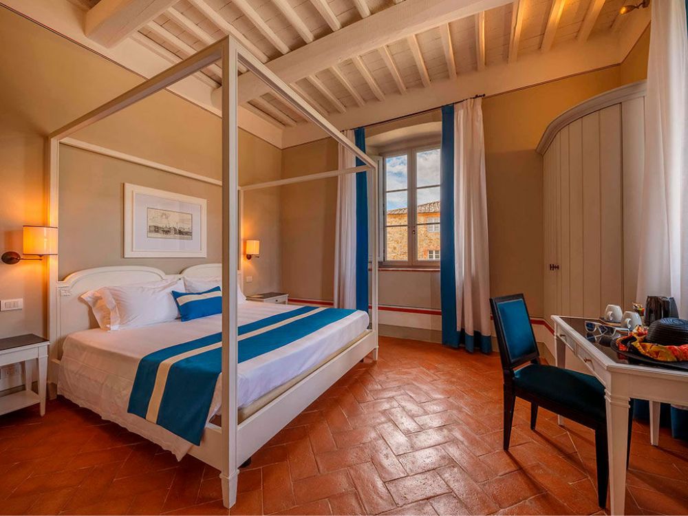 Four poster bedroom at luxury wedding hamlet in Tuscany