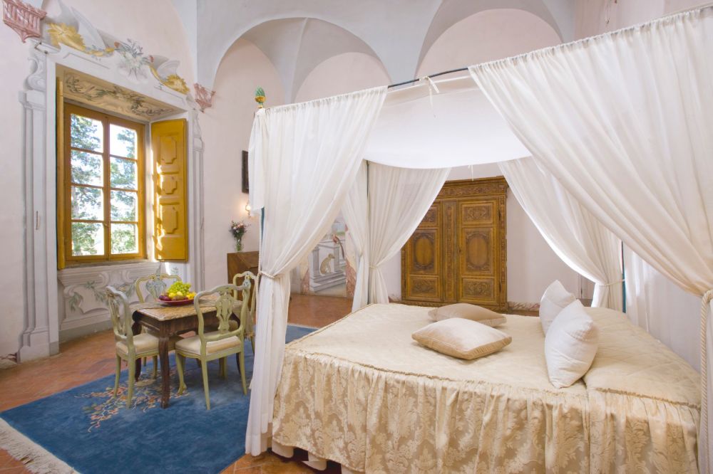Four poster bedroom of the Medieval castle in Tuscany