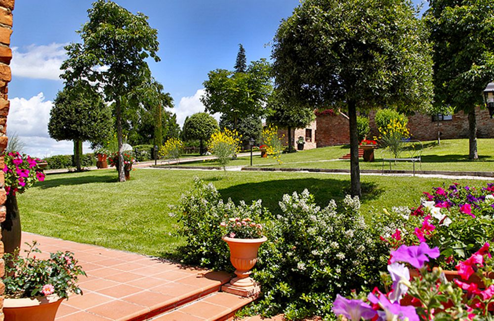 Garden with colored flowers at the villa in Tuscany for weddings