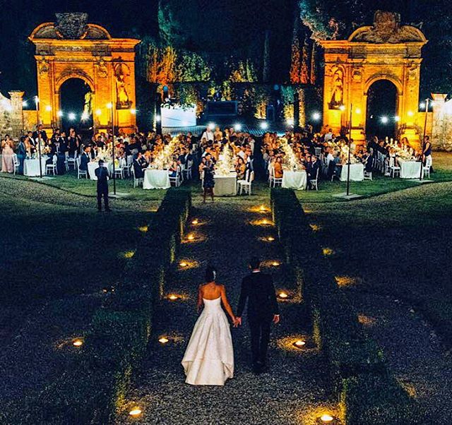 elegant wedding dinner with candles in a elegant villa in siena