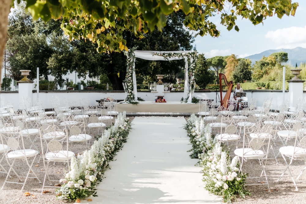 hindu wedding in tuscany ceremony setting with flowers