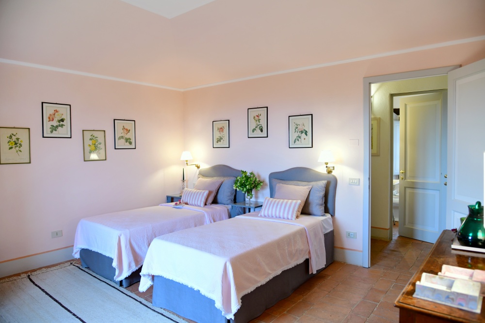 Light blue twin bedroom at accommodation of luxury castle in Siena