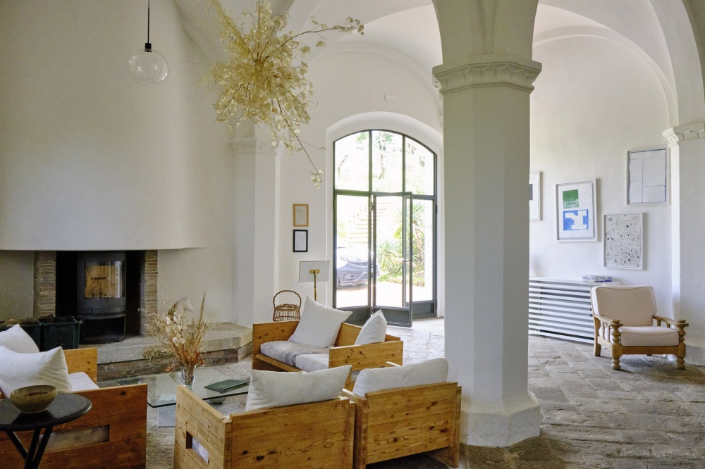 Living room with fire place at organic farmhouse for weddings in Tuscany