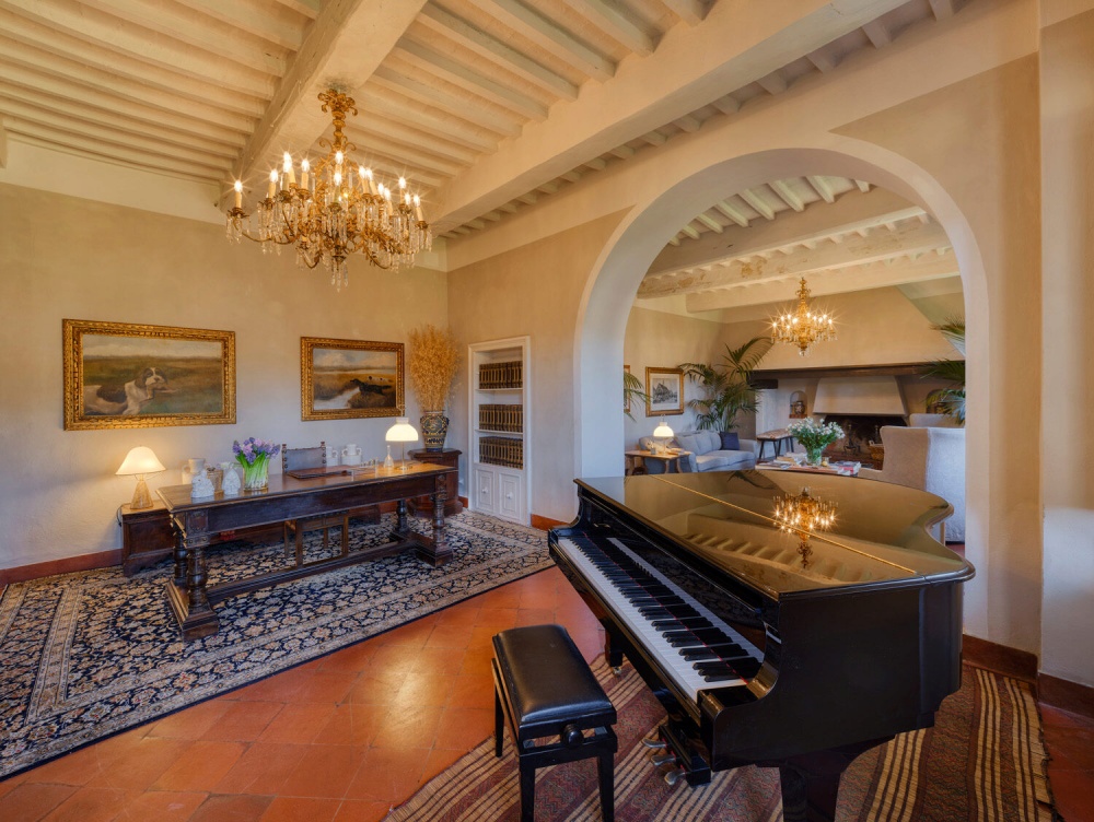 Living room with piano at charming Wedding Farm Resort in Maremma