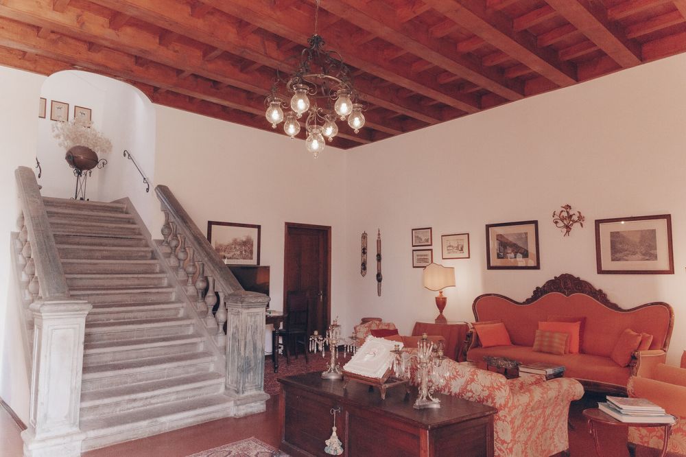 Living room with stairs at romantic villa in Tuscany