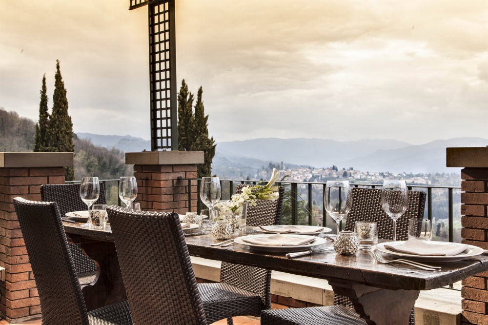 Lunch table with view of Barga at luxury wedding venue in Lucca