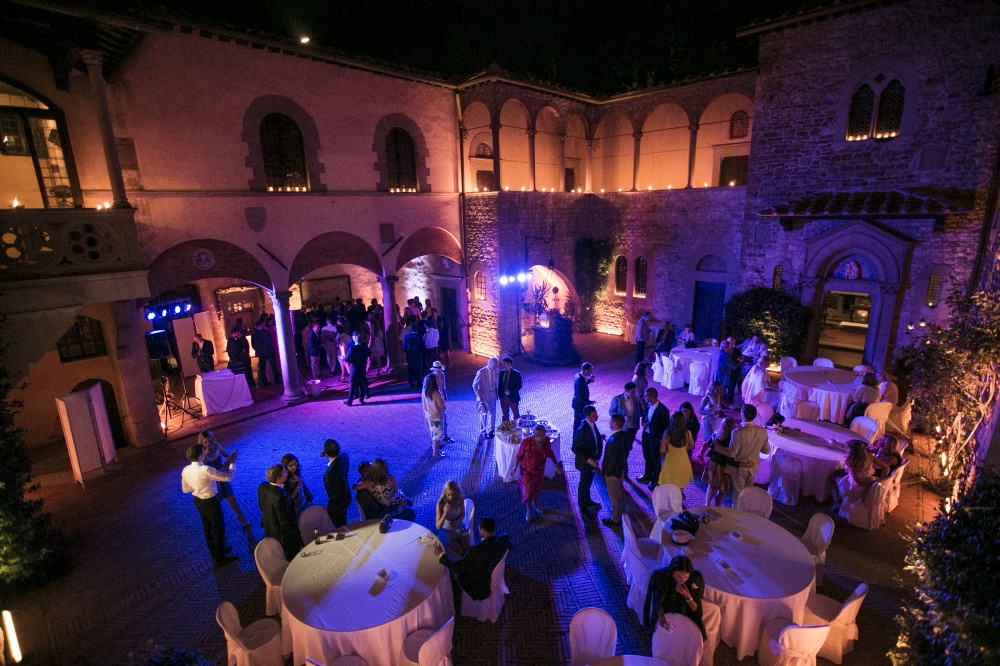 wedding dancing party with lights in a medieval castle in chianti tuscany