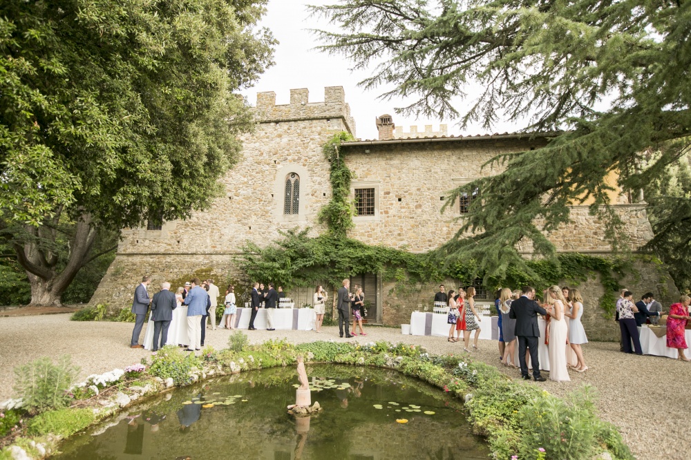 garden with fountain for wedding events in a medieval castle in chianti tuscany