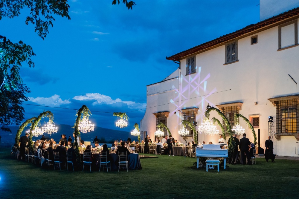 Night table setup and piano in the garden of the villa in Florence for weddings