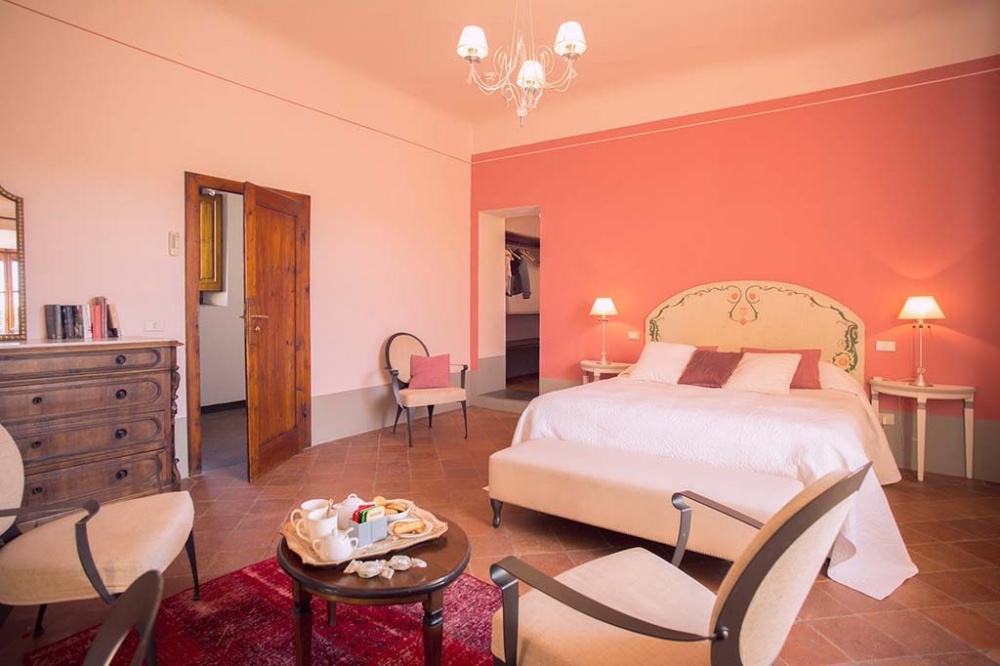 Pink bedroom at luxury wedding castle in Chianti