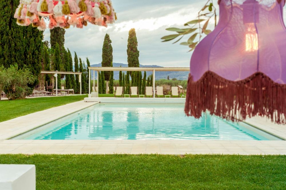 Pool with chandeliers at wedding venue in Maremma