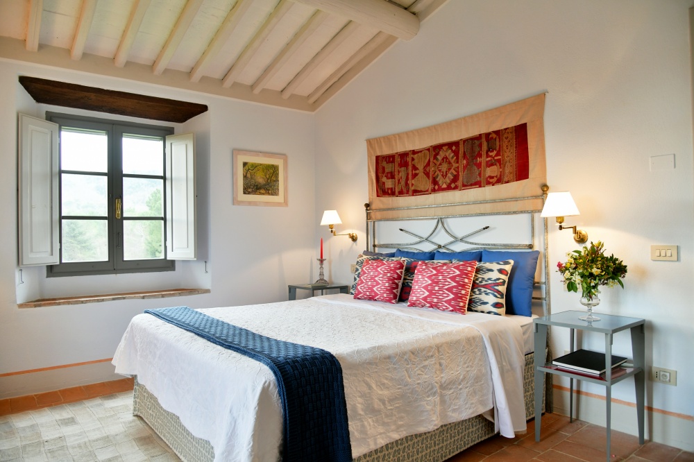 Red and clue bedroom at accommodation of wedding castle in Siena