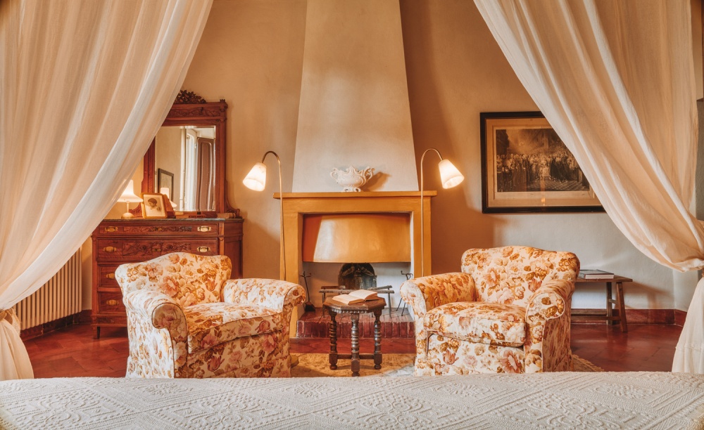 Relax area with fireplace at charming Farm Resort in Maremma