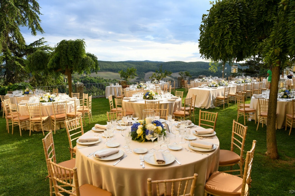 romantic al fresco dining wedding dinner tables with view on siena