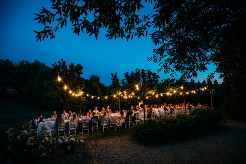 wedding dinner with vintage lights in a romatic villa in siena