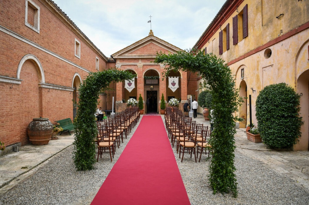 romantic wedding ceremony in front of the chapel in tuscany