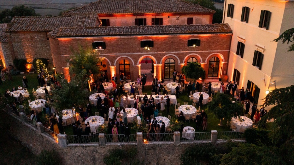 sunset garden tuscan wedding dinner reception with warm light