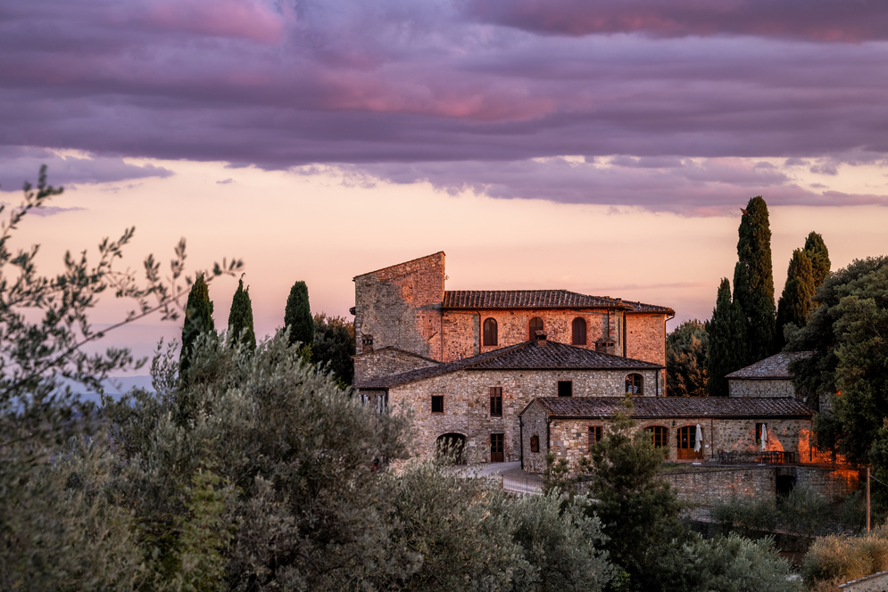 Sunset view of castle for weddings in Tuscany