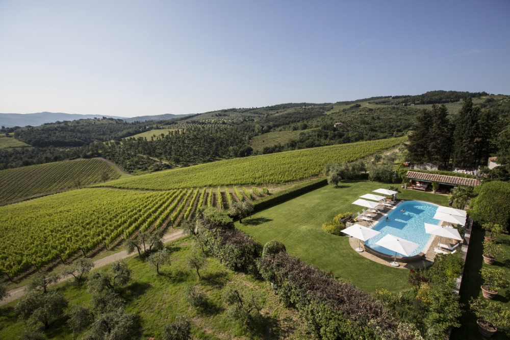 Swimming pool and hills of luxury wedding castle in Chianti