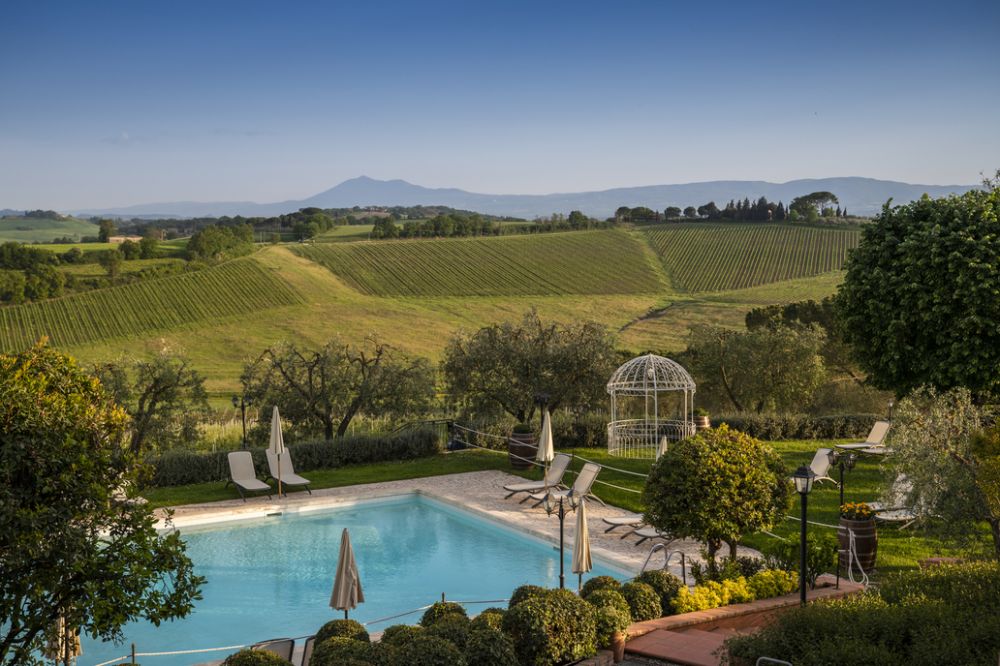 View of the pool and the countryside at the villa in Tuscany for weddings