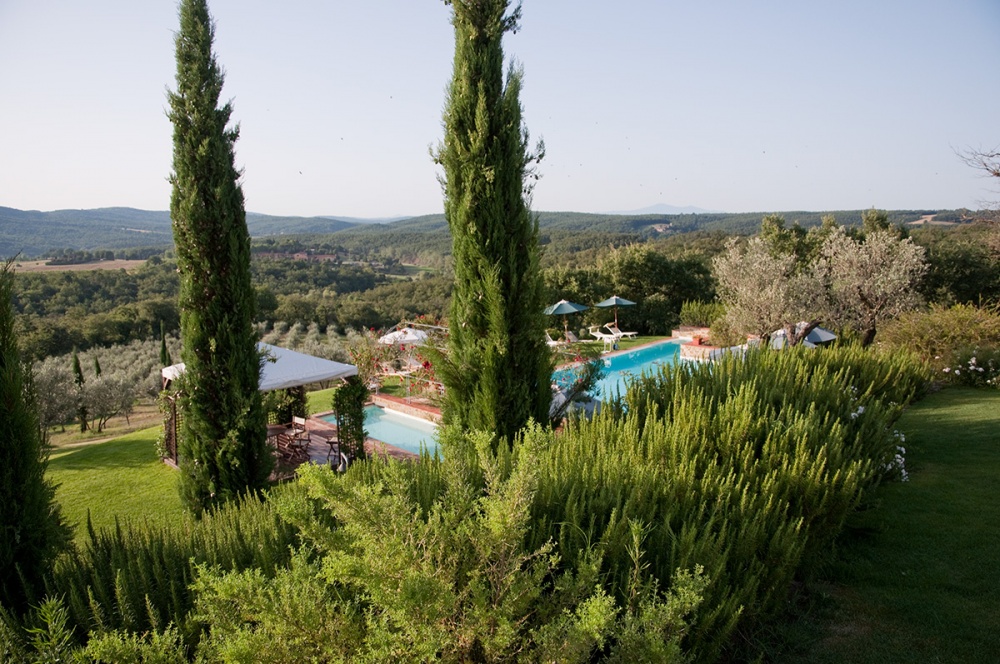 View of pool and countryside at wedding hamlet in Siena