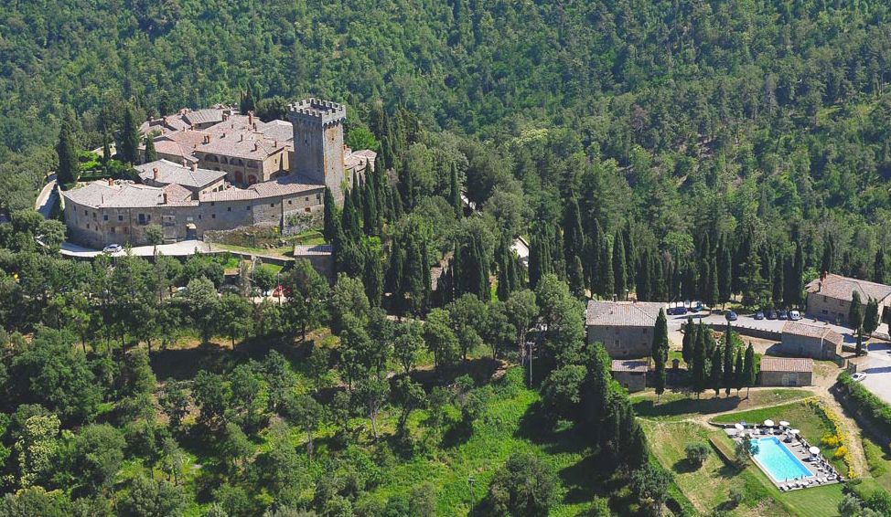 View of the village and the pool at the farmhouse for weddings in Tuscany