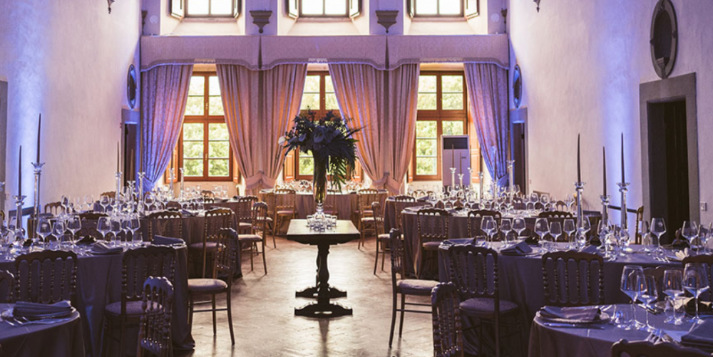 wedding dinner setting in a indoor room of a medici villa in tuscany