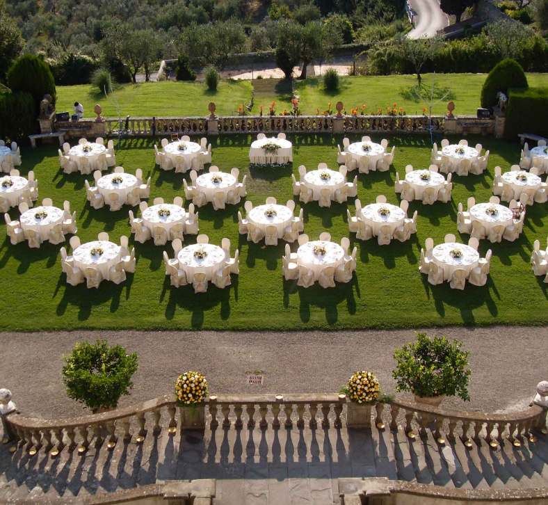 wedding dinner tables setup on the terrace of a villa medicea for weddings in tuscany