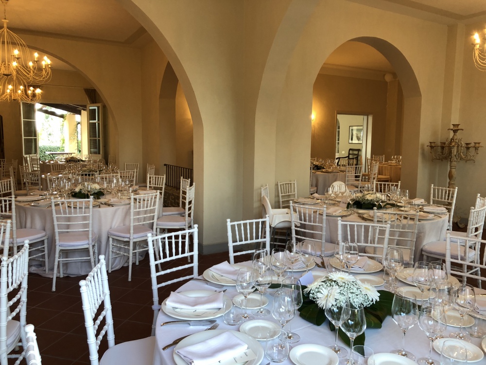 wedding dinner setting in an indoor room in a villa on the tuscan hills