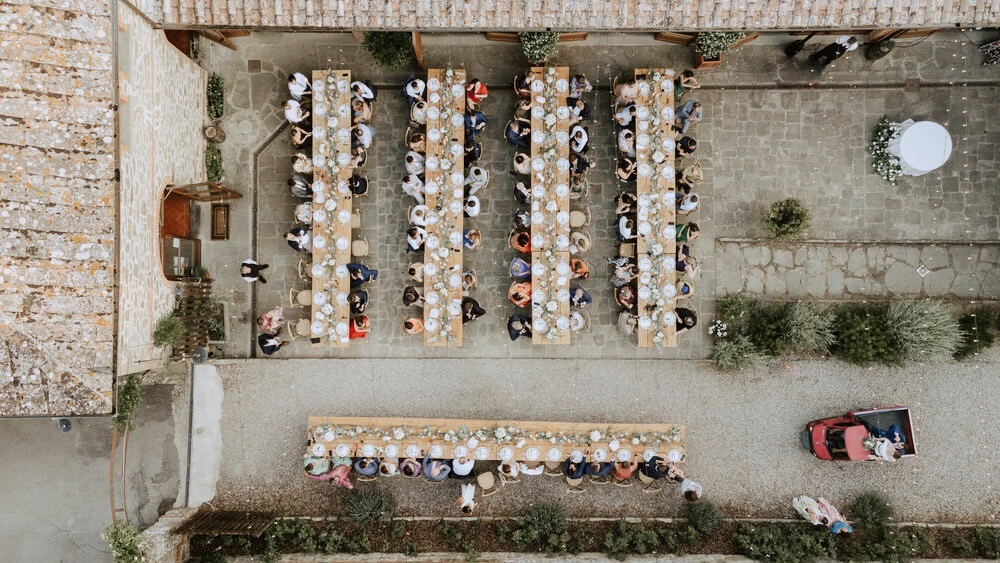 Wedding dinner drone view at farmhouse for weddings in Tuscany