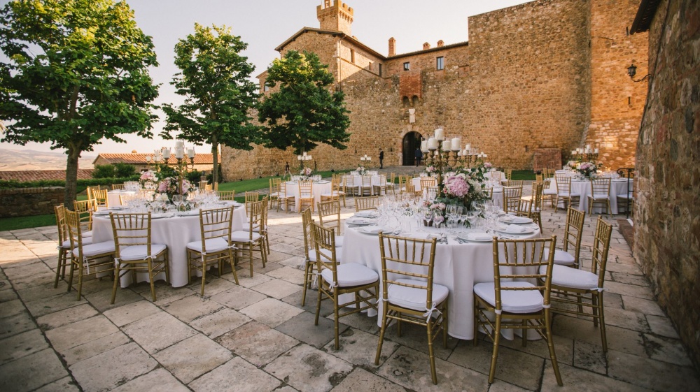 wedding dinner with round tables in the main square of the venue