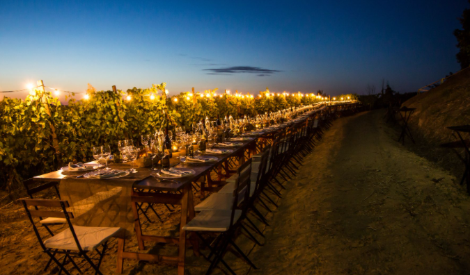 lighting system on the wedding dinner table with vineyards view