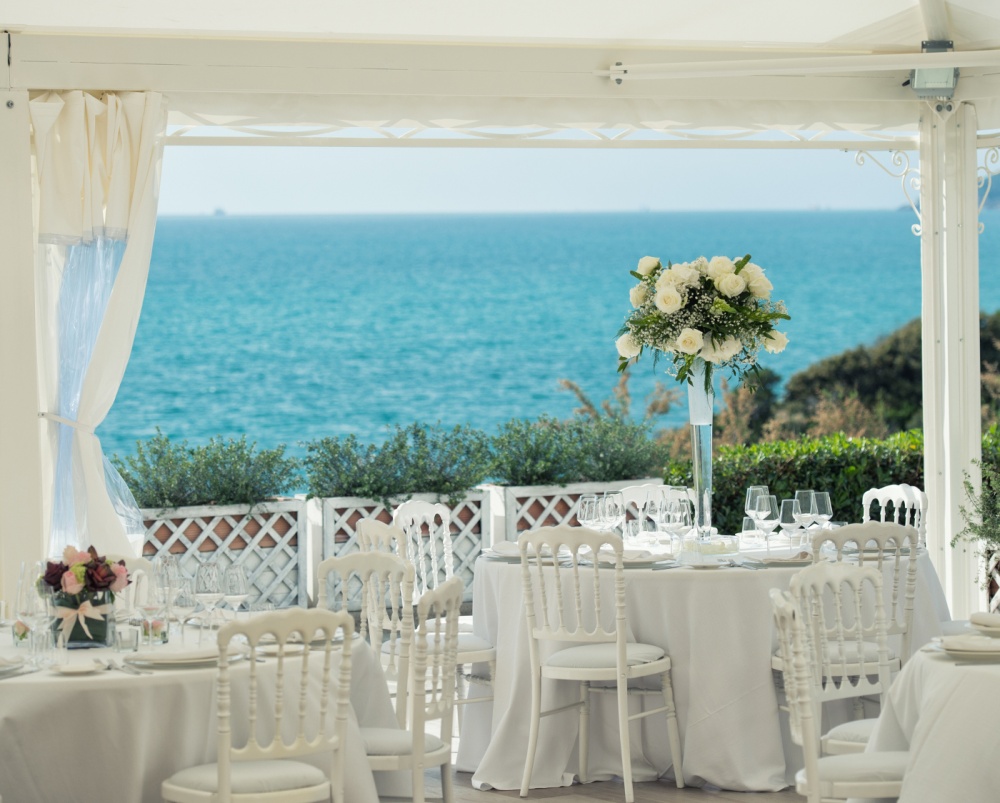 wedding dinner setting in a villa on the sea in tuscany