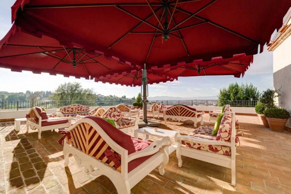 White and red lounge area at luxury resort for marriage in Florence