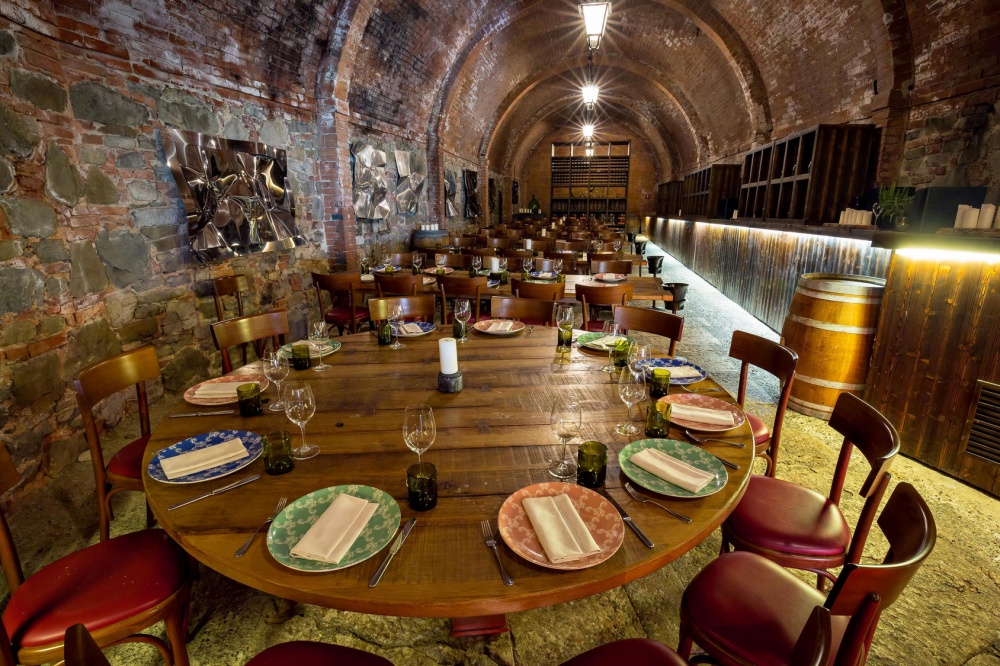 Wooden tables at restaurant of luxury wedding resort in Tuscany