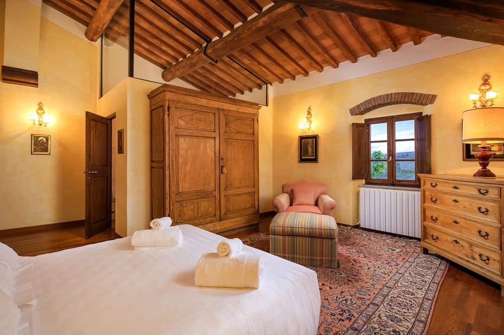 Yellow bedroom at romantic wedding farmhouse in Tuscany