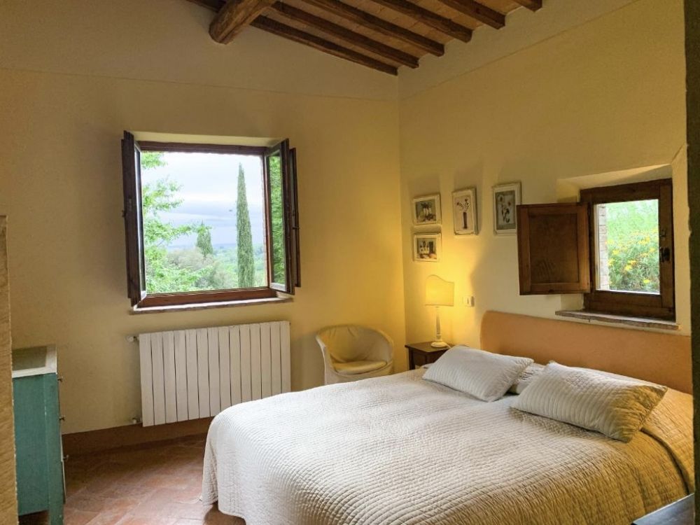 Yellow bedroom at the wedding villa in Siena