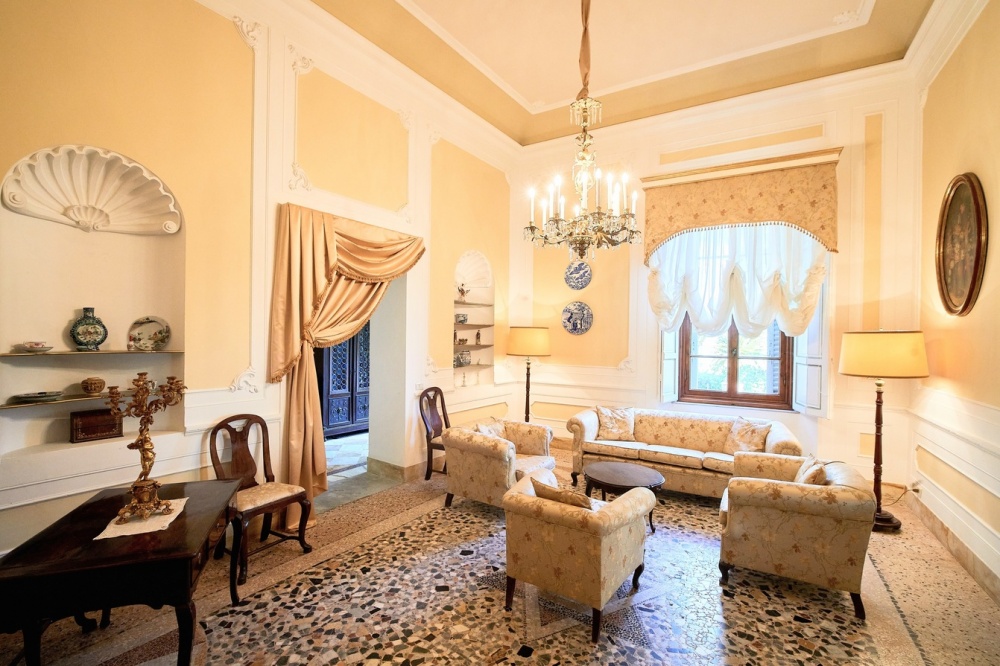 Yellow living room at wedding hamlet in Tuscany